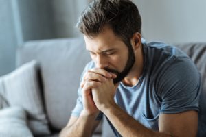 worried man sitting alone