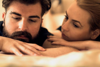 woman comforting a man