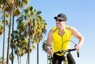Man excitedly riding bike to therapy in Florida.
