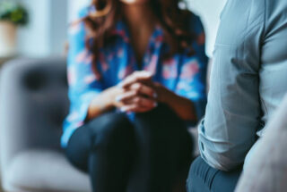 woman sitting across from emdr therapist in a treatment session for addiction