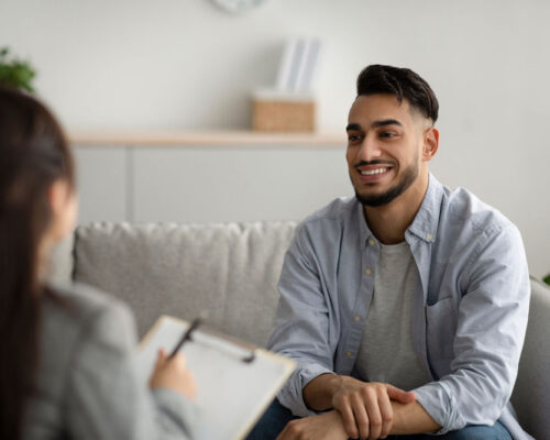 happy man in emdr therapy session for addiction treatment