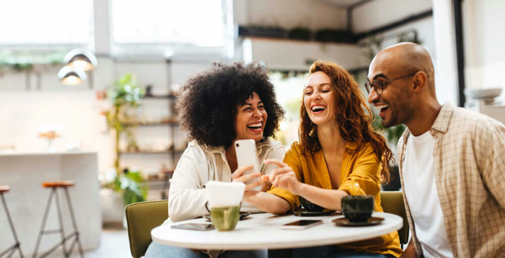 Diverse group of adults smiling together during rehab programs