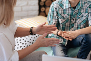 Healthcare provider meeting with a client to discuss safe, supervised recovery from prescription drugs
