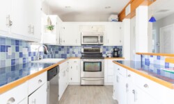 Functional kitchen space featuring a stove, microwave